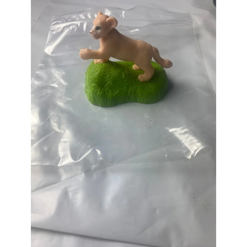 Lion Cub Figurine on Grass Base Wildlife Safari Animal Toy Plastic Tan Green